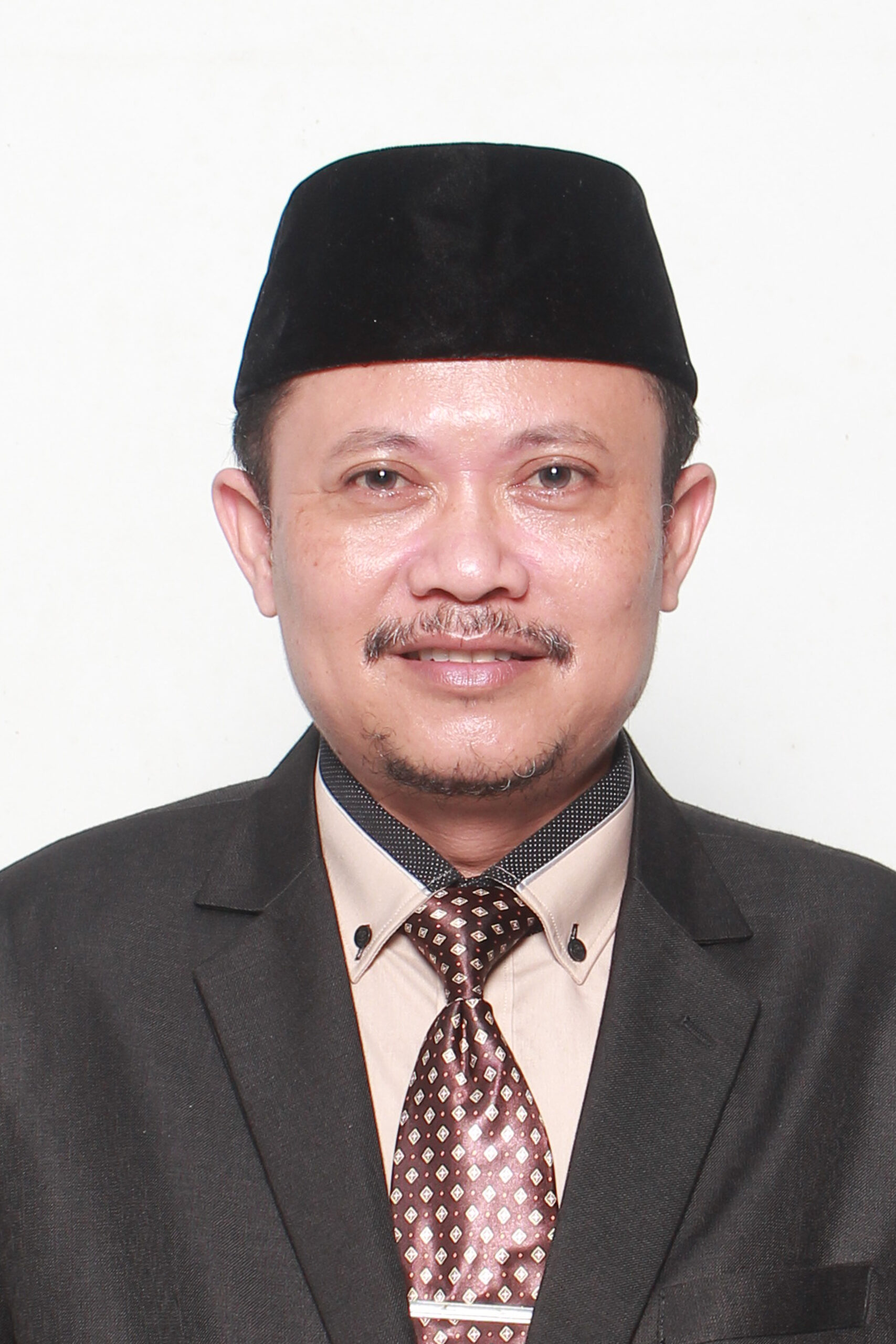 Prof. Dr. Dikdik Harjadi, M.Si