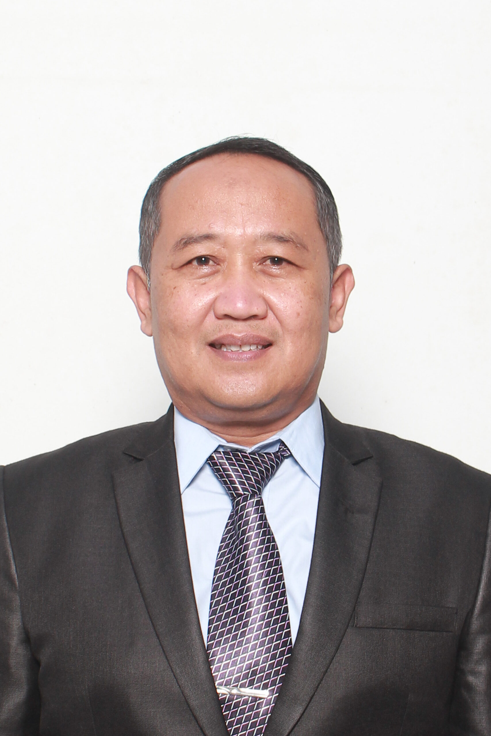 Dr. Haris Budiman, M.M.